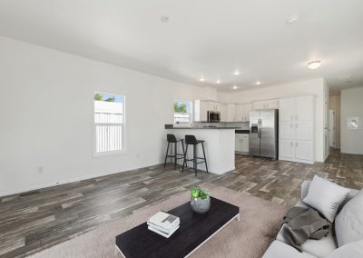 Model kitchen and living room at Desert Valley Oasis Manufactured Homes in Mesa Arizona